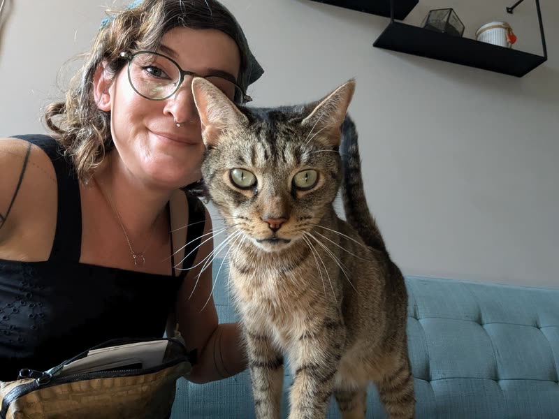 Emma Black with Kiwi, a tabby cat